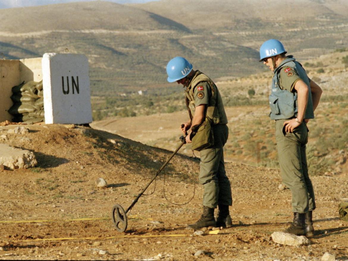 UN workers removing landmines.
