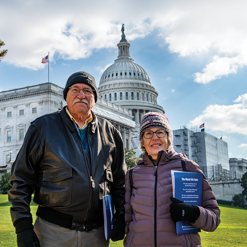 Advocates stand in front of Capitol building at Annual Meeting 2022