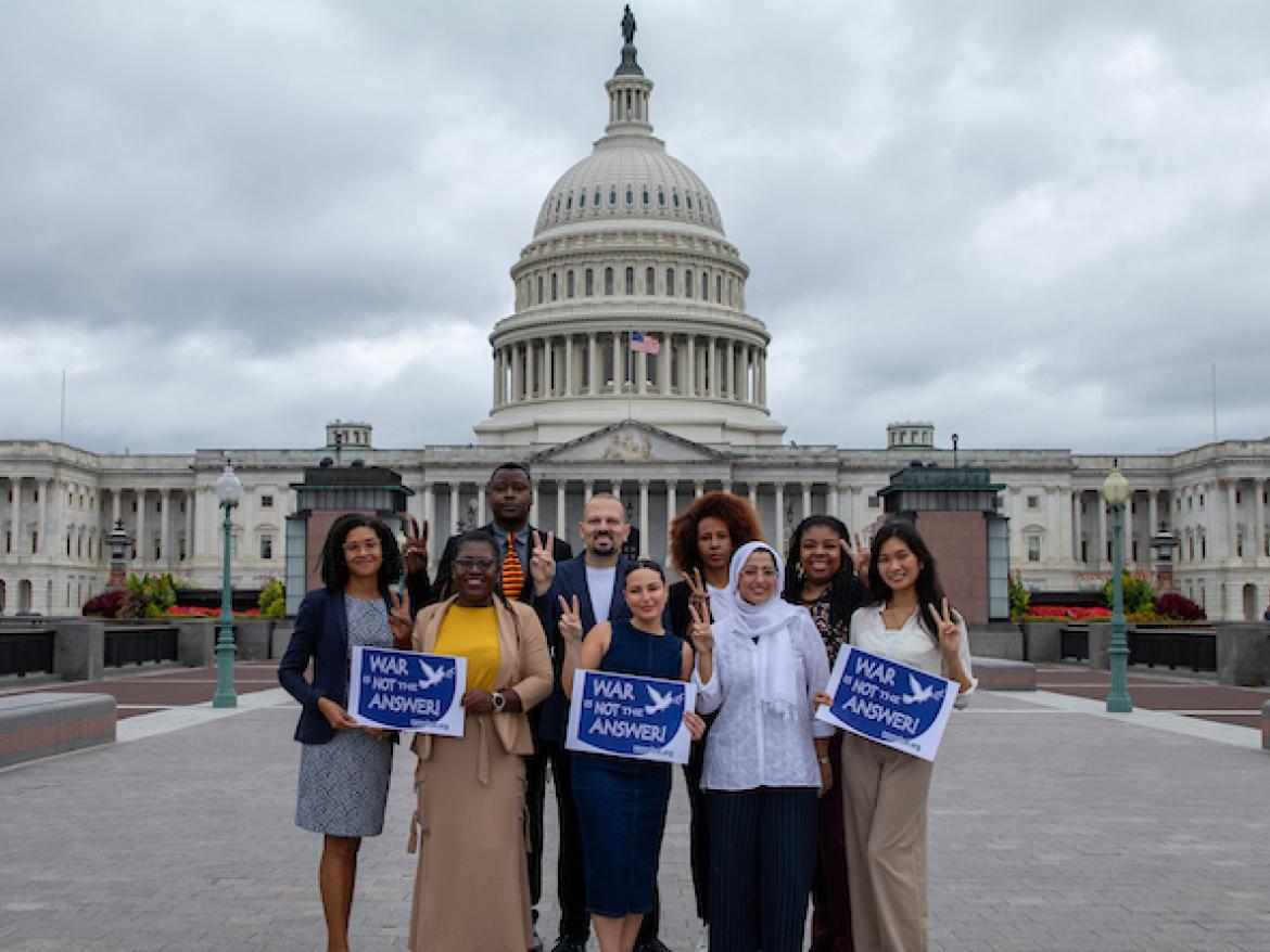 Diaspora Gathering 2024 in front of Capitol with signs saying "War is Not the Answer'