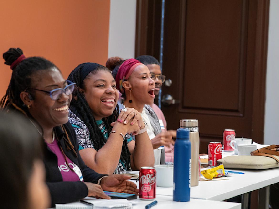 Organizers talking at the Diaspora Organizing Gathering in 2024