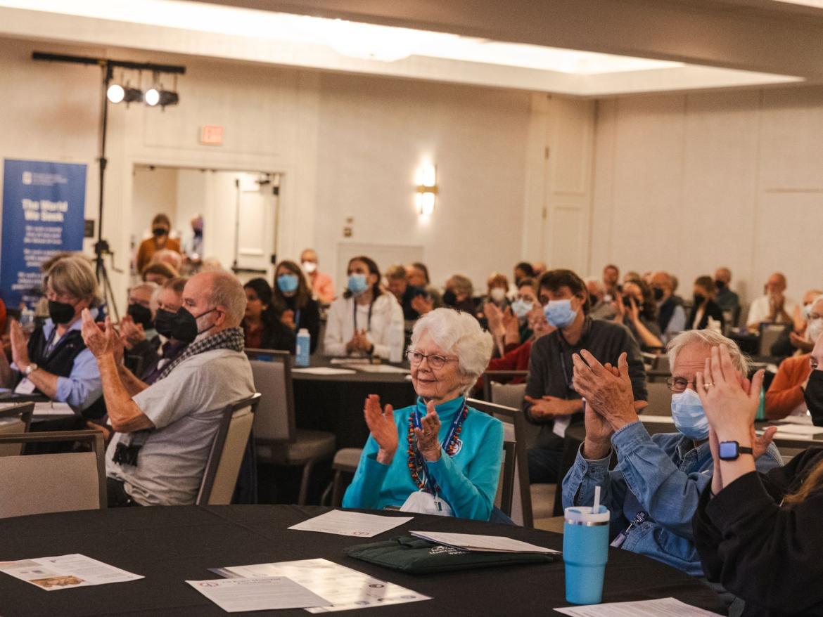 participants clapping at Annual Meeting 2024