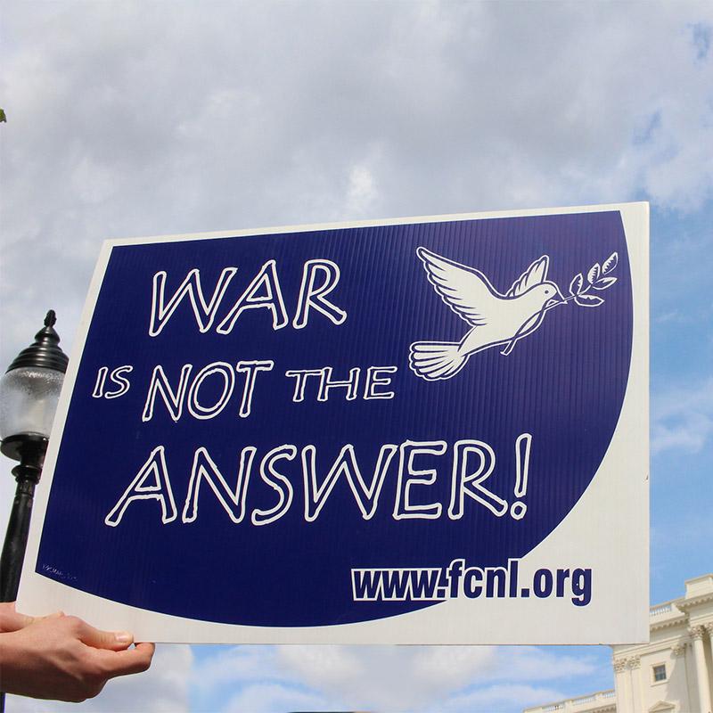 War is Not the Answer sign in front of U.S. Capitol